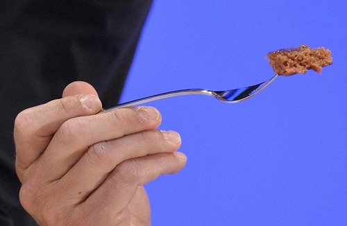 The in-vitro burger, cultured from cattle stem cells, the first example of what its creator says could provide an answer to global food shortages and help combat climate change, was fried in a pan and tasted by two volunteers. (Toby Melville/Reuters)